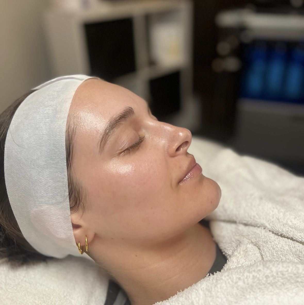 Client with glowing skin after a Collagen Boost Facial at Shine